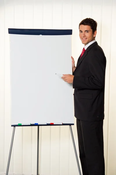 Successful business man with flipchart — Stock Photo, Image