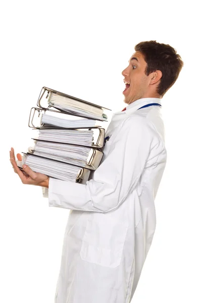 Doutor em apuros com pilhas de arquivos . — Fotografia de Stock