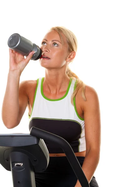 Woman in training for endurance on the ergometer. — Stock Photo, Image