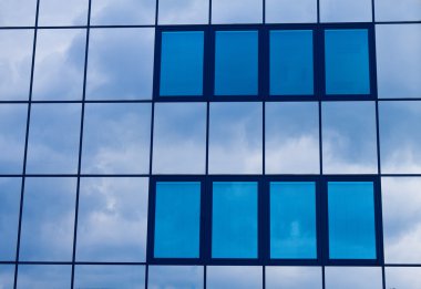 Facade with windows facing a bã ¼ rohauses. clipart