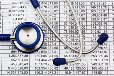 Balance sheet figures and stethoscope clipart