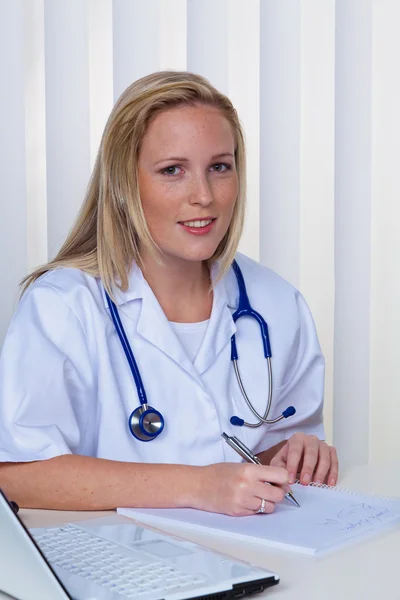 Young doctor in the practice — Stock Photo, Image