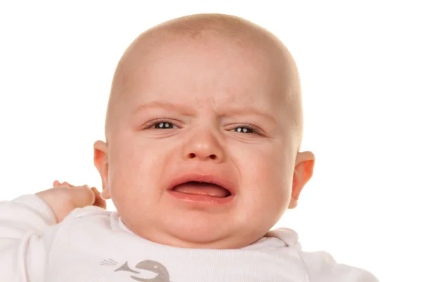 Cara de um bebê chorando, triste — Fotografia de Stock