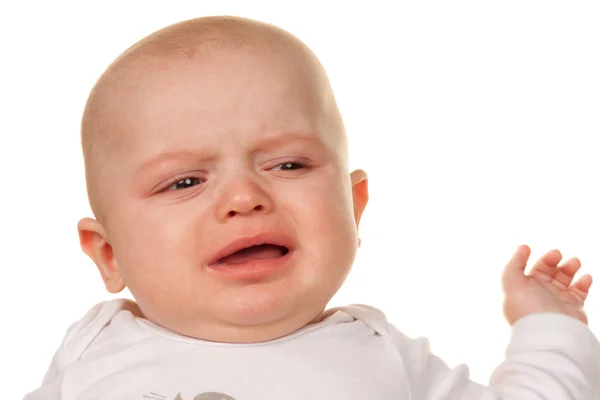 Cara de um bebê chorando, triste — Fotografia de Stock