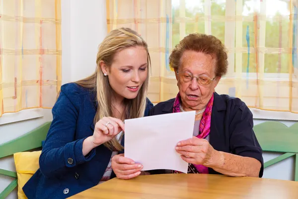 Grandson and grandmother. contract, will — Stock Photo, Image