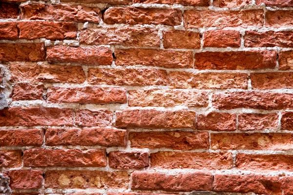 Eine Ziegelmauer als Hintergrund — Stockfoto