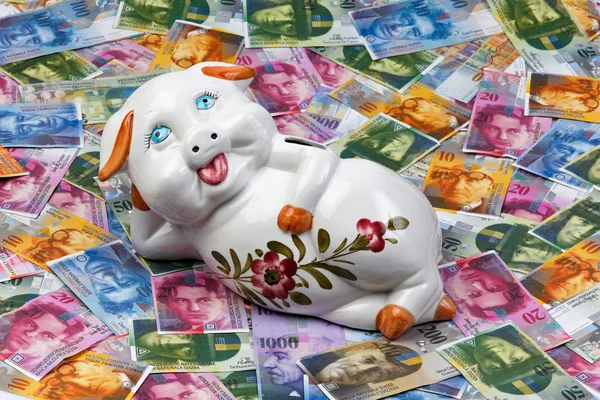 Swiss franc and piggy bank — Stock Photo, Image
