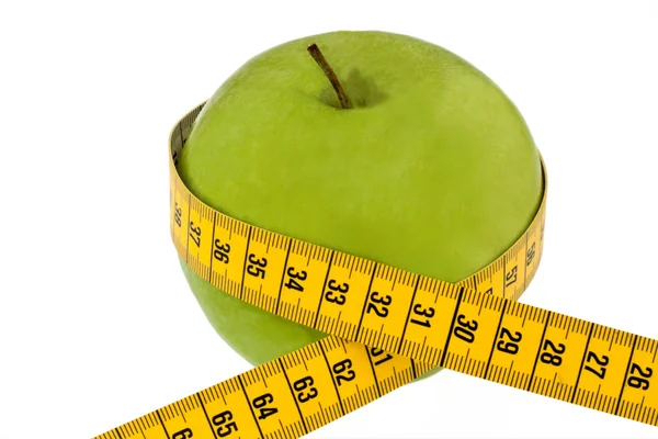 Manzana con cinta métrica. Símbolo jalá con frutas y hortalizas — Foto de Stock