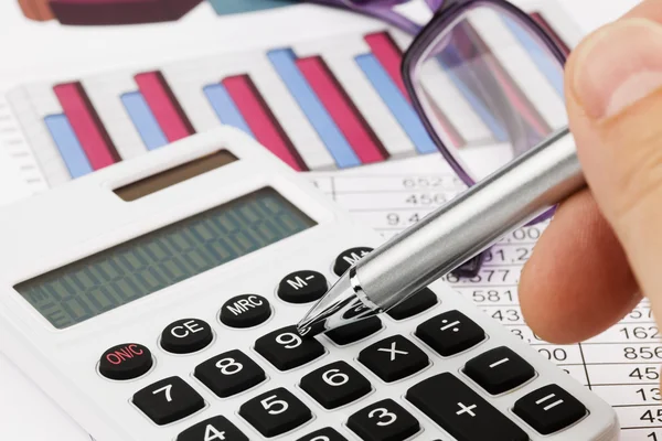 Graphics calculator and a balance sheet — Stock Photo, Image