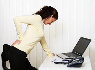 Back pain of the intervertebral disc at office work clipart