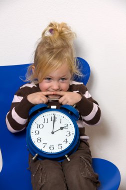 Child with daylight saving time clock as a symbol clipart