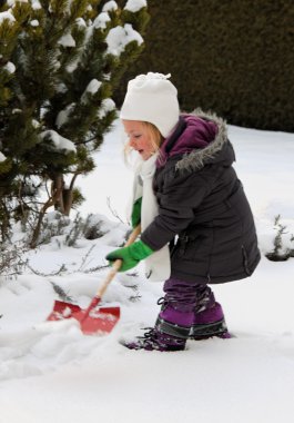 Shoveling snow in winter with snow shovel clipart