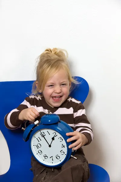 Child with daylight saving time clock as a symbol — Stock Photo, Image