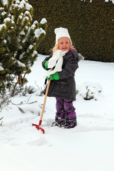 stock image Shoveling snow in winter with snow shovel