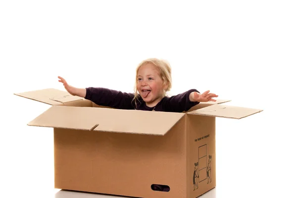 Child in moving box. if the move to box. — Stock Photo, Image