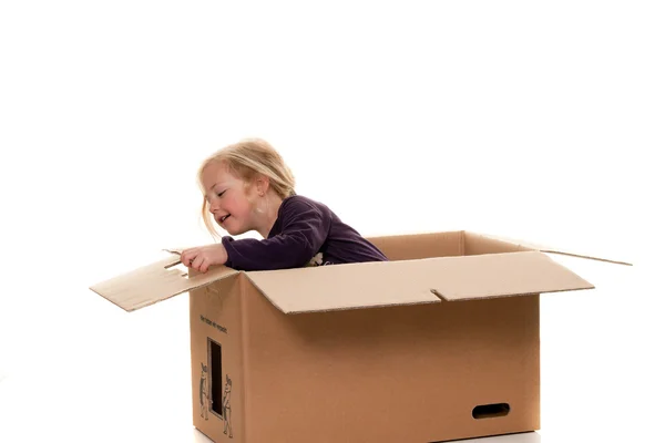 Child in moving box. if the move to box. — Stock Photo, Image