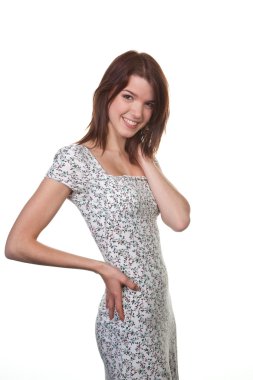 Young woman in a dress in a pretty pose clipart