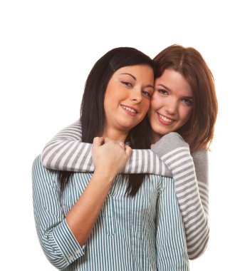 Two girlfriends in a tender embrace clipart