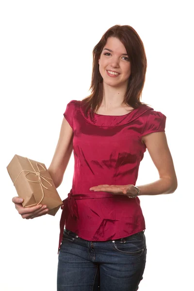 Pretty young woman with christmas package — Stock Photo, Image