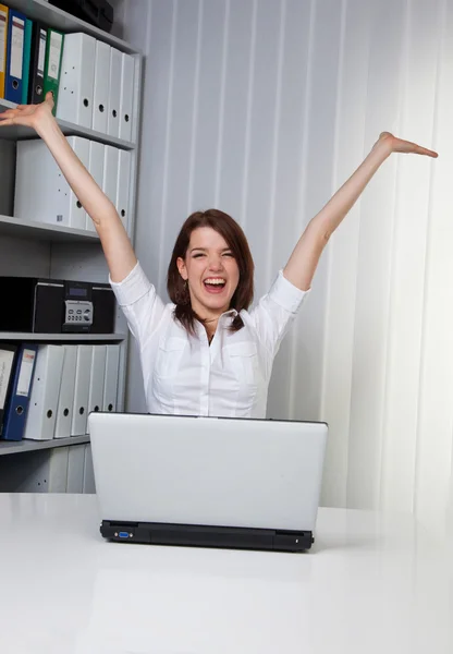 Young girls cheering at a computer — Stock Photo, Image