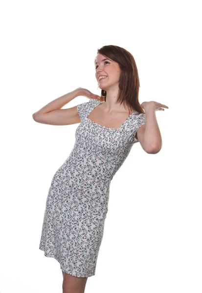Young woman in a dress in a pretty pose — Stock Photo, Image