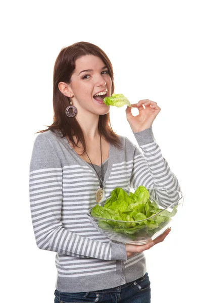 Young woman tried a green salad — Stock Photo, Image
