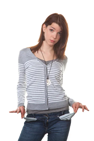Broke, young woman showing her empty pockets — Stock Photo, Image