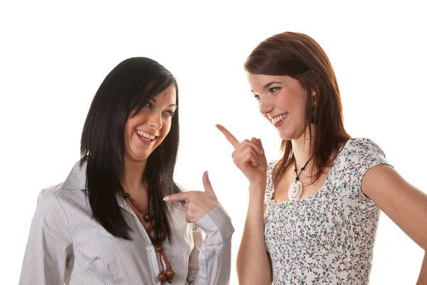 Duas jovens mulheres sussurrando uma para a outra — Fotografia de Stock