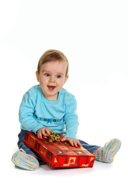 Small child with a birthday gift package clipart