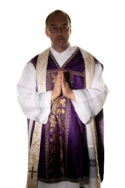 Catholic priest, while praying in church clipart