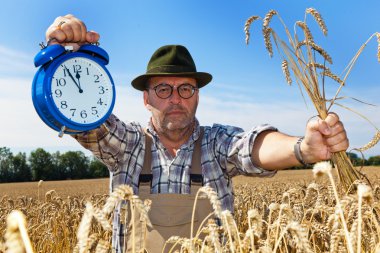 Farmer with clock 11:55 clipart