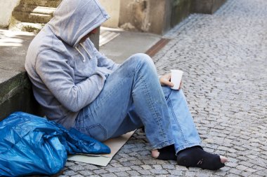 Unemployed homeless beggar is clipart
