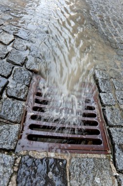 Lid of a channel for rain water clipart