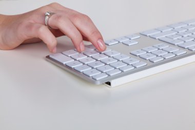 Hand on computer keyboard clipart