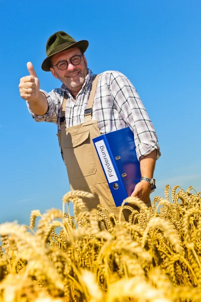 Фермер с портфелем "продвижение" на зерновой коробке — стоковое фото