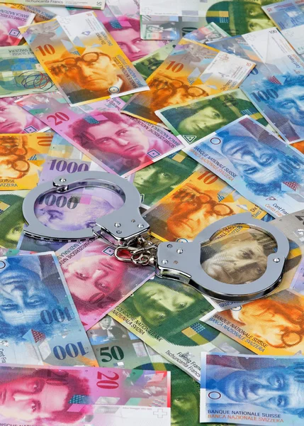 stock image Handcuffs and swiss francs