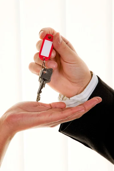 Real estate broker with an apartment key — Stock Photo, Image