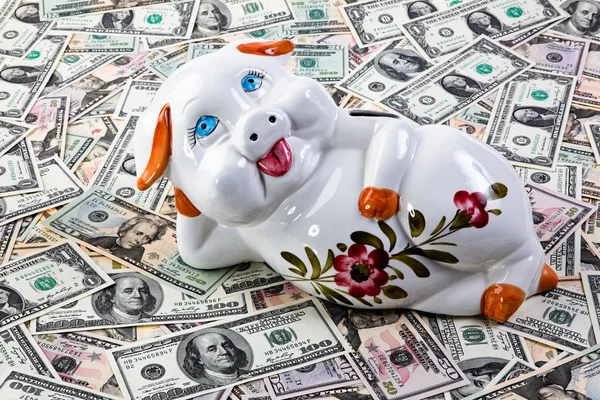 Dollar notes and piggy bank Stock Picture