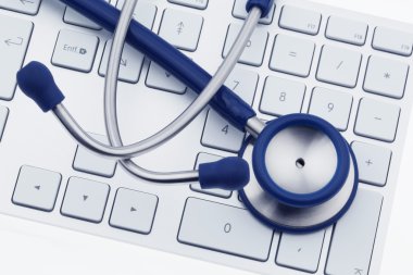 Stethoscope on computer keyboard clipart