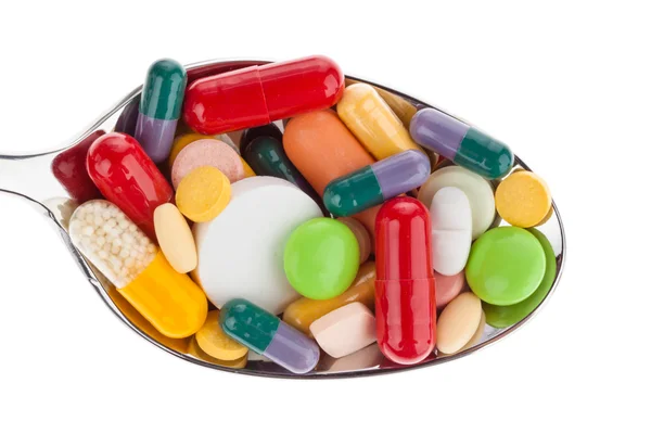 Tabletter och mediciner på sked — Stockfoto