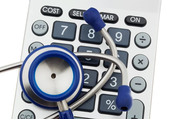 Calculator and stethoscope — Stock Photo, Image