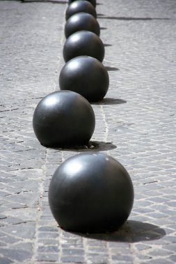 Iron balls on cobblestone clipart