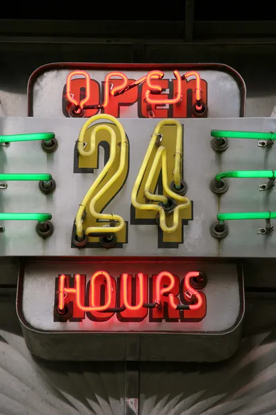 Neon sign displaying open 24 hours — Stock Photo, Image
