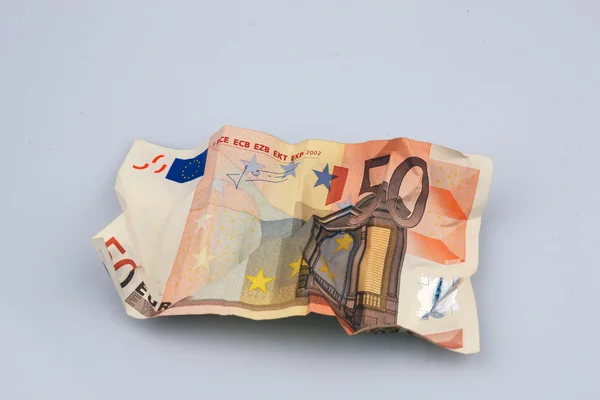 Stock image 50 Euro bill crumpled on light background