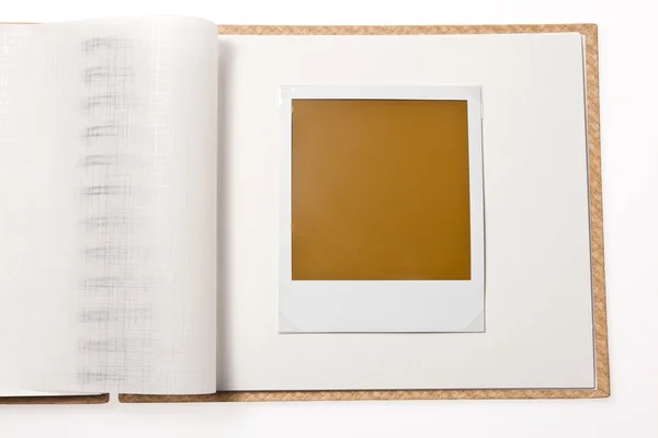 Isolated blank polaroid photo in photo album — Stock Photo, Image