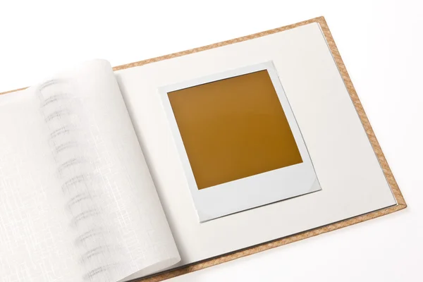 Isolated blank polaroid photo in photo album — Stock Photo, Image