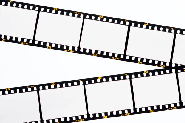 Deslize tiras de filme com molduras vazias — Fotografia de Stock