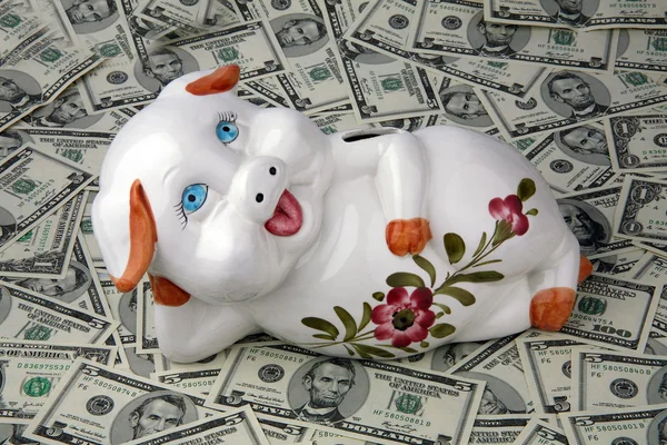 Dollars and piggybank Royalty Free Stock Images