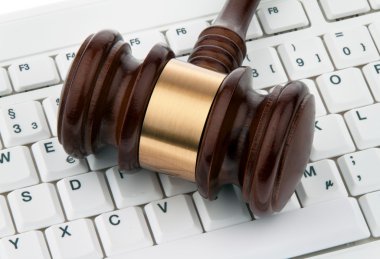 Gavel and keyboard. legal certainty on the interne clipart