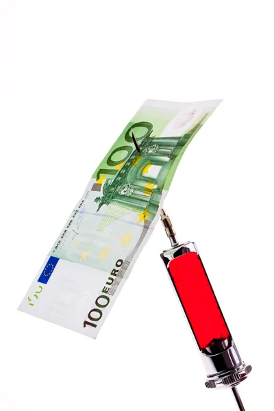 Ін'єкційна голка та шприц з євро . — стокове фото